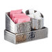 An American Metalcraft stainless steel sugar caddy on a counter with sugar and sugar packets.