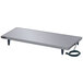 A rectangular metal Hatco Glo-Ray heated shelf on a stainless steel table with a power cord.