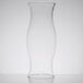 A clear glass vase on a white surface.