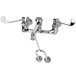 A T&S chrome wall mount service sink faucet with 6" wrist action handles.