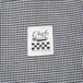 A close-up of Chef Revival houndstooth fabric in black and white.