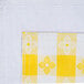 A yellow and white checkered fabric with a white stitch.