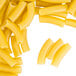 A close up of a pile of Regal Ziti pasta tubes on a white background.