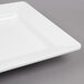 A white rectangular melamine tray with a white rim.
