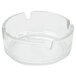 A clear glass Arcoroc ashtray with a small center hole.