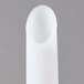 A white plastic sausage stuffer tube.
