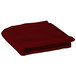 A folded burgundy Intedge table cover.