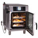 A close up of food in an Alto-Shaam Combitherm CT Express Electric Boiler-Free Combination Oven.