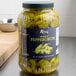 A jar of Regal Whole Pepperoncini on a counter.