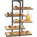 A Cal-Mil multi-level bamboo shelf display with desserts on it.
