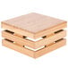 A Cal-Mil bamboo square crate riser with three compartments on top.