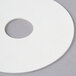 A white circular disc with a hole in the center.