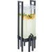 A Cal-Mil acrylic beverage dispenser with black frame and ice chamber filled with a lemon drink.