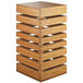 A Cal-Mil bamboo square crate riser with multiple layers of shelves.