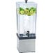 A Cal-Mil plastic beverage dispenser with ice and fruits.