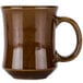 A close-up of a brown Tuxton Princess mug with a wooden handle.