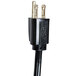 A black electrical cord with two gold plugs.