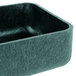 A square green metal container with a black lid.
