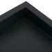 A square black replacement base for a Cal-Mil beverage dispenser on a table.