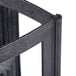 A close up of a black metal frame with a black handle.