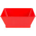 A red plastic square serving basket with a white background.