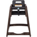 A brown Koala Kare stackable high chair with a black seat.