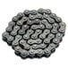 A black Avantco drive chain with a bunch of holes.
