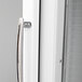The white glass door with a handle on a Turbo Air Ice Merchandiser.