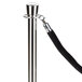 A silver Aarco rope style crowd control stanchion pole with a black rope.