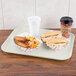 A Carlisle Glasteel tray with a hot dog, sandwich, coffee, and a drink on it.