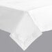 A white Hoffmaster tablecloth on a table with a folded edge.