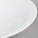 A CAC Super Bright White Coupe Porcelain Bowl with a white rim.