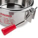 A stainless steel kettle with a red handle for a Carnival King PM470 popcorn popper.