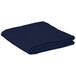 A folded navy blue table cover on a white surface.