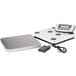 An Edlund stainless steel digital pizza scale with a screen.