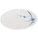 A white plate with blue bamboo design.
