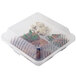 A clear plastic GET 3-compartment container with food inside.