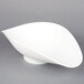 A white plastic scoop with a curved edge.