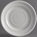 A Tuxton Concentrix white china plate with a spiral pattern.