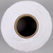 A white standard label roll with a black circle on the end.