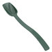 A green plastic spoon with long handle.