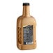 A bottle of white DaVinci Gourmet White Chocolate Flavoring Sauce with a black label.
