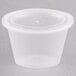 A Pactiv oval plastic souffle container with a lid.