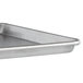An Advance Tabco half size aluminum sheet pan with a wire in rim.