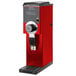 A red and black Bunn bulk coffee grinder.