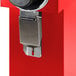 A red Bunn bulk coffee grinder with a metal handle and cleaning lever.