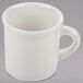 A Tuxton eggshell white china coffee mug with a handle.
