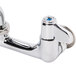 A chrome Equip by T&S wall mounted faucet with lever handles.