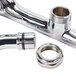 A chrome plated Equip by T&S wall mount pipe with lever handles.