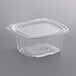 A clear plastic Dart deli container with a flat lid.